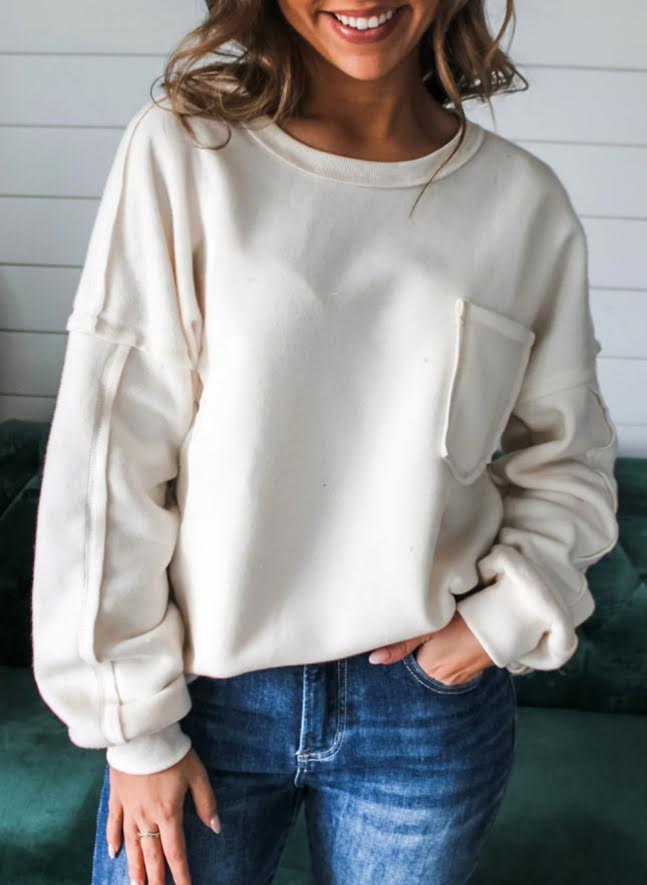 White exposed seam sweatshirt
